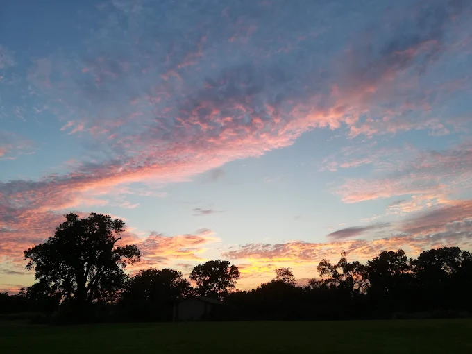 Sunset sky over the open grounds near Cahokia Mounds historic site outside St. Louis